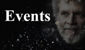 A close-up of an older man with curly hair and a beard appears next to the word "Events" in large white text on a dark background with light bokeh effects.